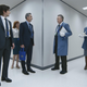 Zach Cherry, Adam Scott, Britt Lower, John Turturro, Christopher Walken, Claudia Robinson interact in Severance’s maze-like hallways